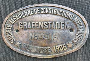 Fabrikschild SACM Grafenstaden. Fabriknummer: 4515, Baujahr: 1906. Messingguss oval, glatt mit Rand. BxH =&nbsp;245 x 155 mm. Das Schild ist ein Tenderschild der CP 351 bis 365.